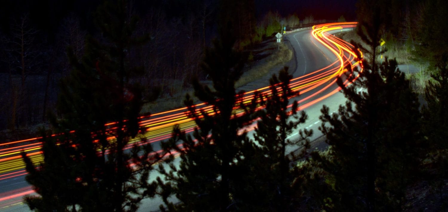 long exposure photography of vehicles on freeway in night