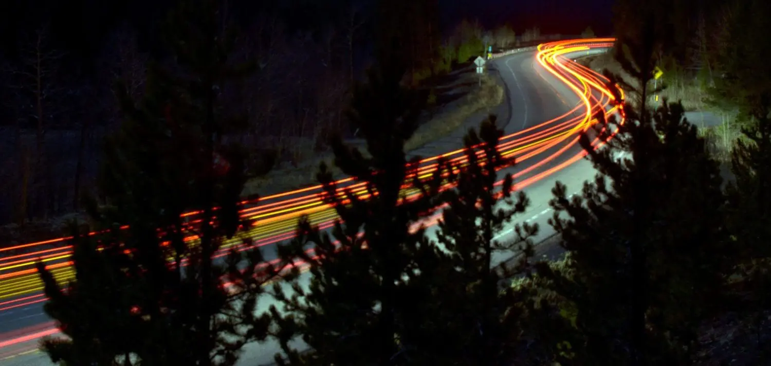 long exposure photography of vehicles on freeway in night