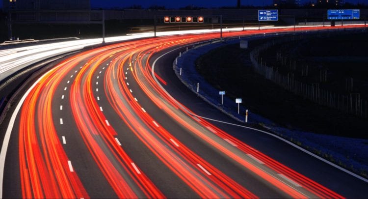 long exposure photography of vehicles on freeway in night