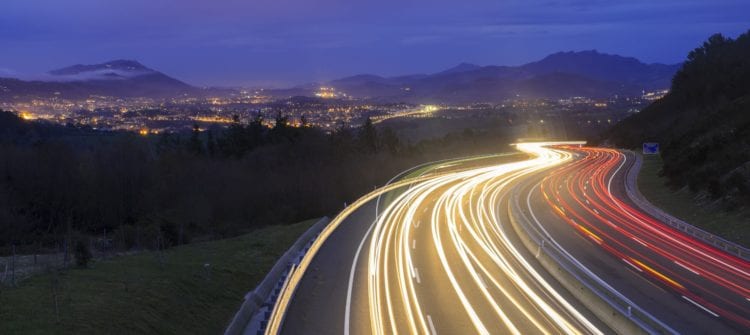 long exposure photography of vehicles on freeway in night