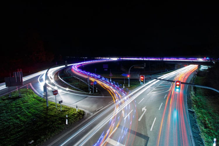 long exposure photography of vehicles on freeway in night