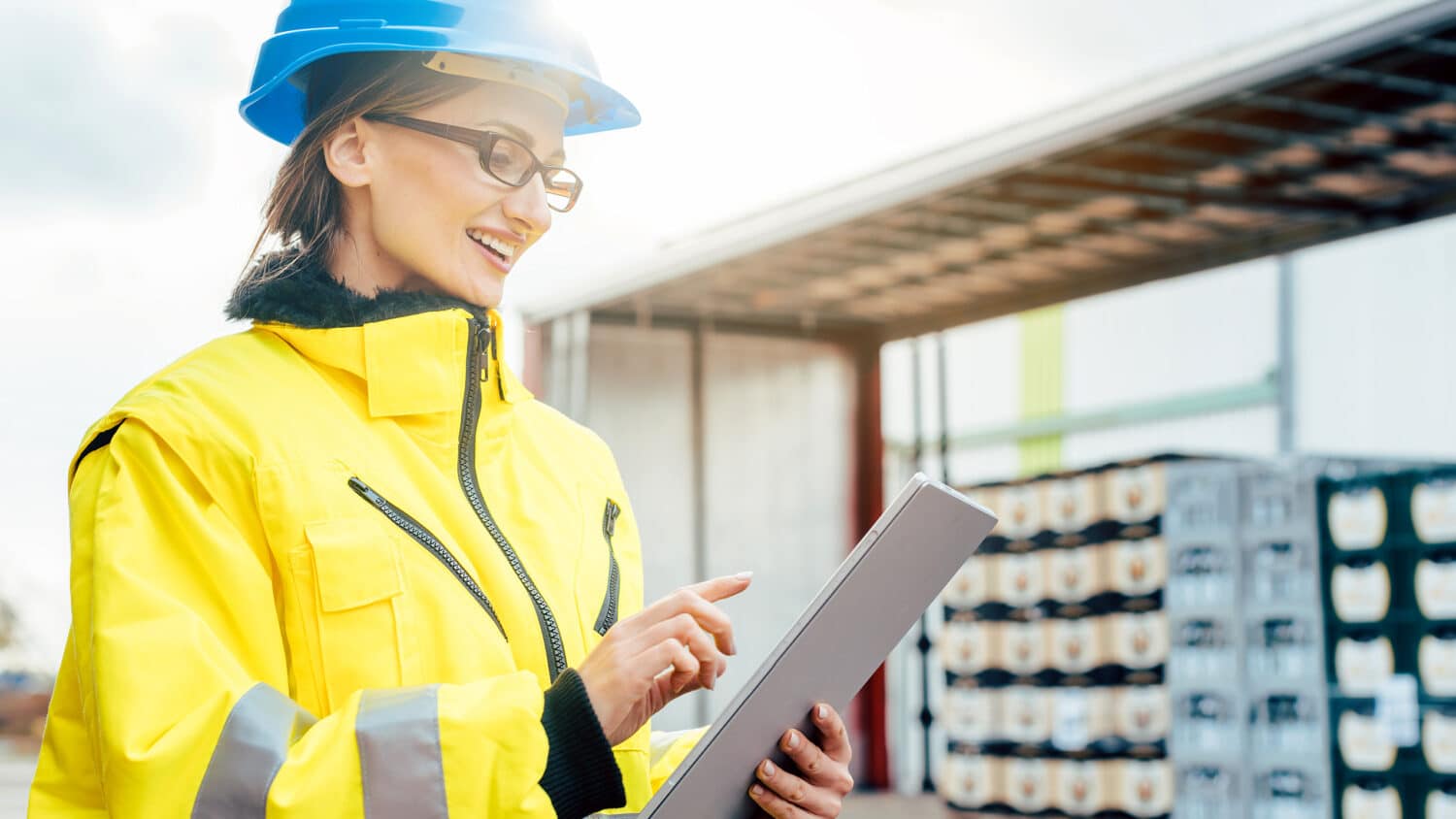 woman hard hat smiling supply chain management