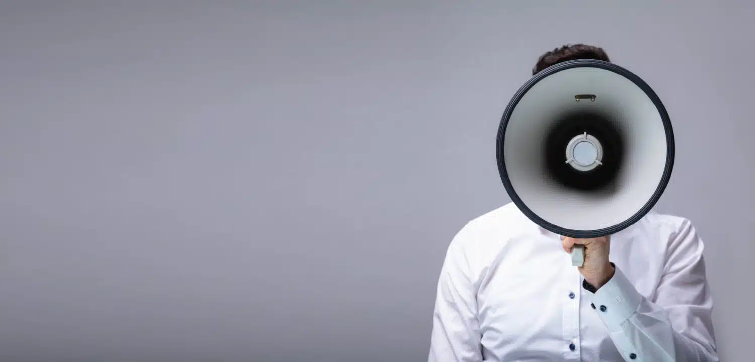 Man speaking into a megaphone